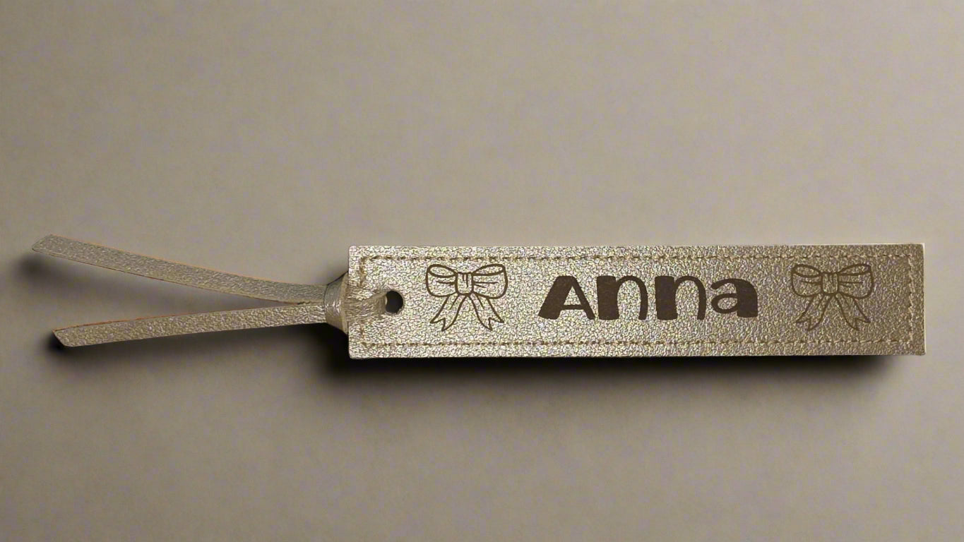 Leather PU bookmark with a name and bows on it