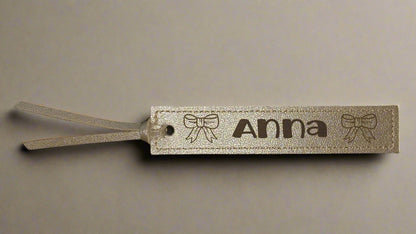 Leather PU bookmark with a name and bows on it