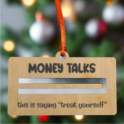 Decorative tag with 'Money Talks' text on a Christmas tree background